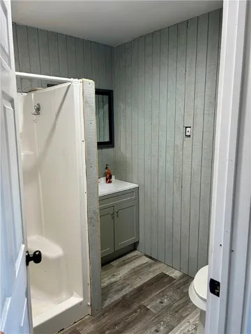 a bathroom with a sink and shower