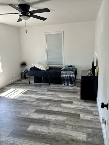 a living room with a couch and a dresser