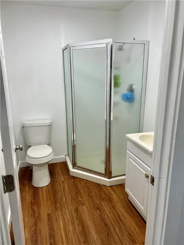 a bathroom with a toilet and a shower