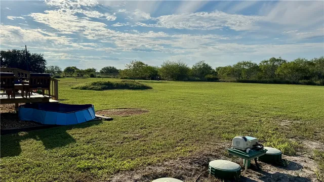 a view of a lake with a yard