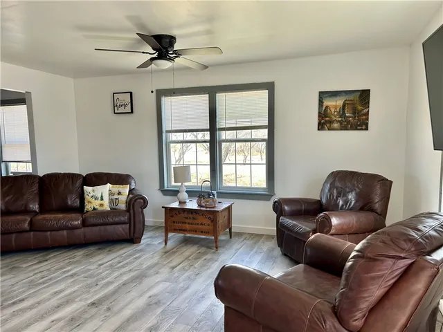 a living room with furniture and a window