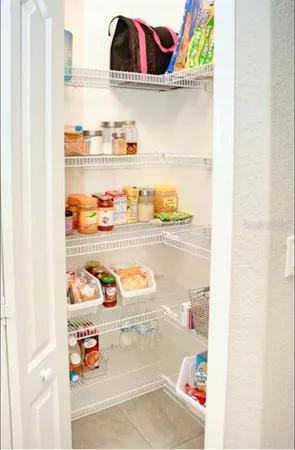 a utility room with an empty shelf