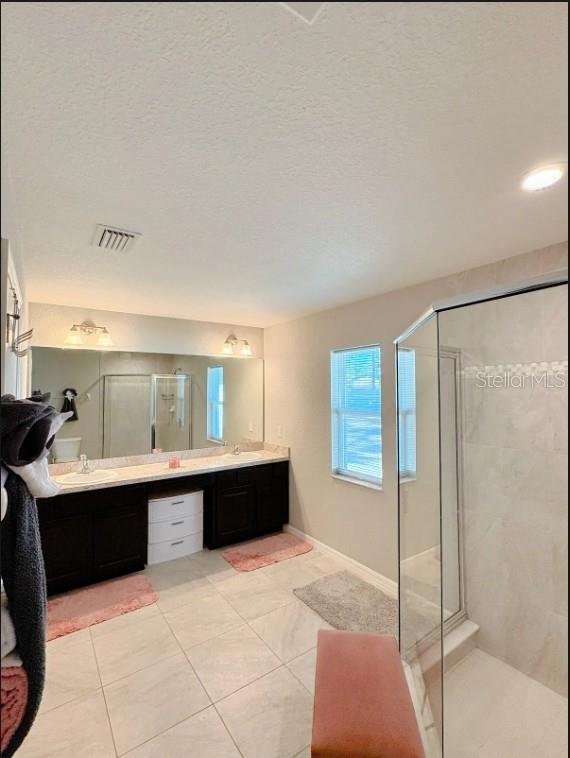 12365 Indigo Bunting Road Weeki Wachee, FL 34614 - Photo 24 of 39 a spacious bathroom with a tub and shower