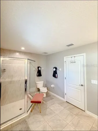 a bedroom with a bed and a tv on table