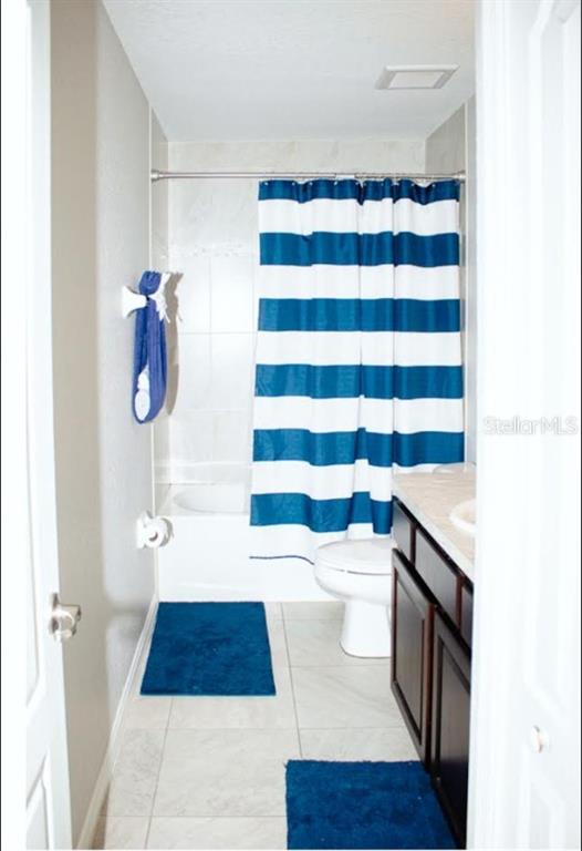 12365 Indigo Bunting Road Weeki Wachee, FL 34614 - Photo 31 of 39 a bathroom with a sink a toilet a shower and a bathtub