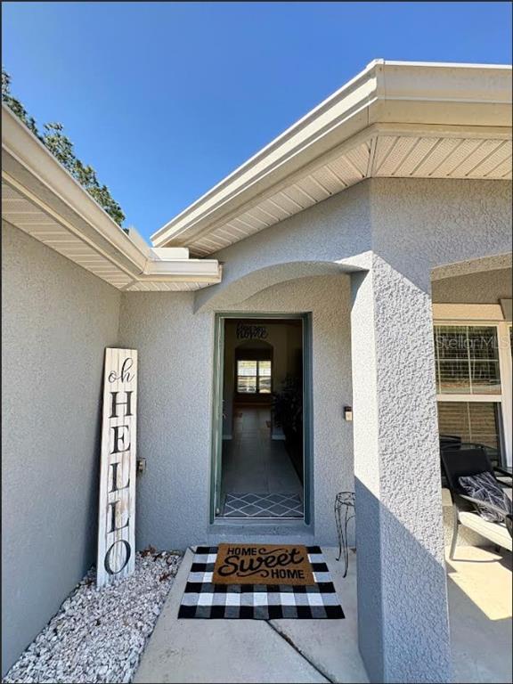 12365 Indigo Bunting Road Weeki Wachee, FL 34614 - Photo 5 of 39 a living room with furniture