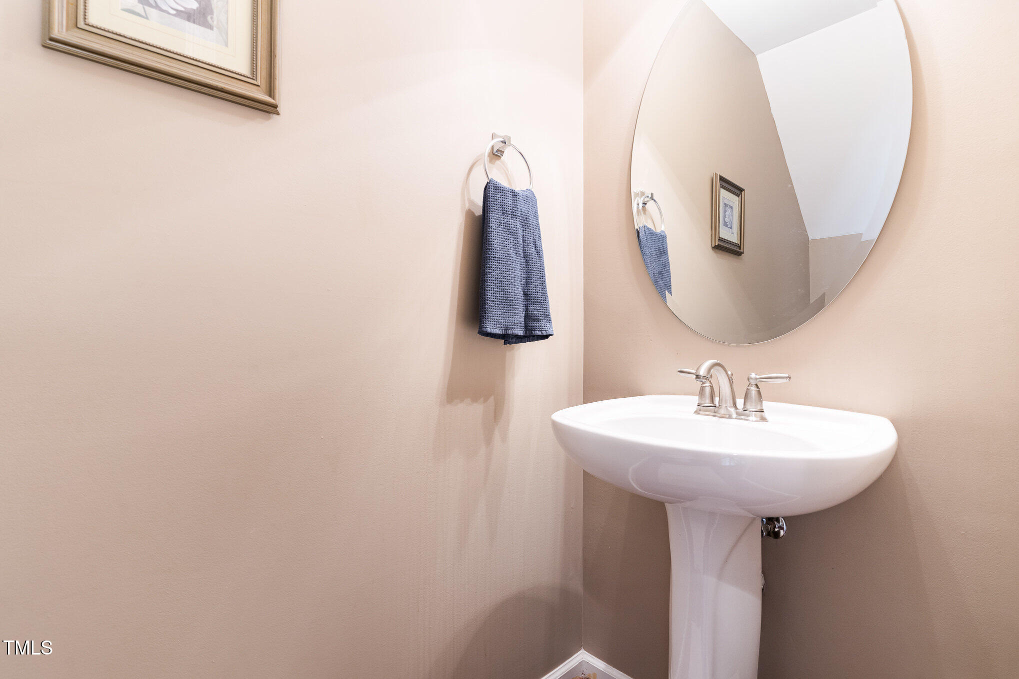 4732 Altha Street Raleigh, NC 27606 - Photo 9 of 23 a bathroom with a sink and mirror