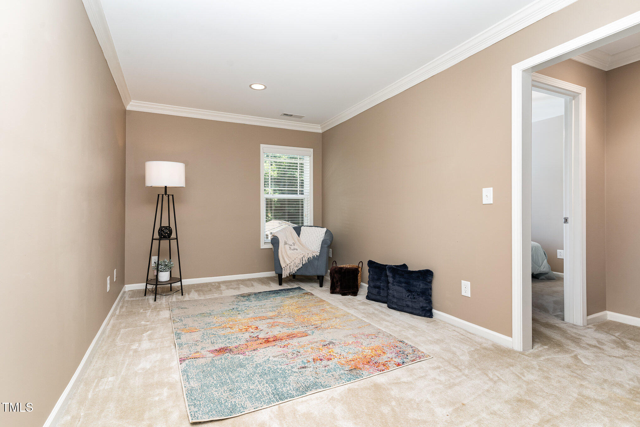 4732 Altha Street Raleigh, NC 27606 - Photo 10 of 23 a view of a room with gym equipment and a window