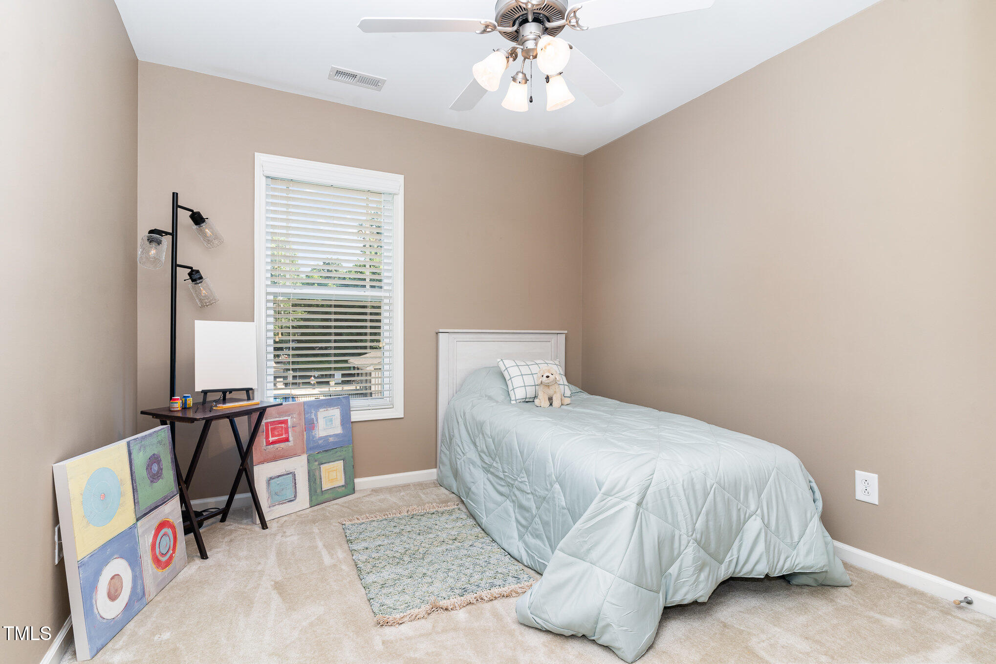 4732 Altha Street Raleigh, NC 27606 - Photo 13 of 23 a bedroom with a bed and a table