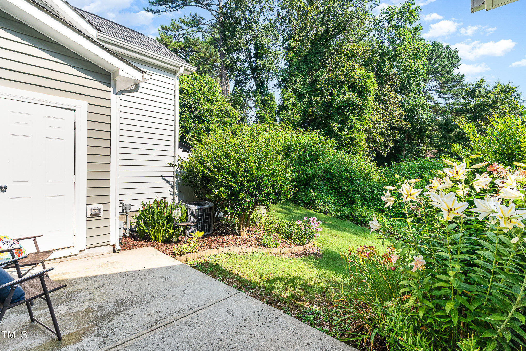 4732 Altha Street Raleigh, NC 27606 - Photo 15 of 23 a view of backyard with potted plants and a bench