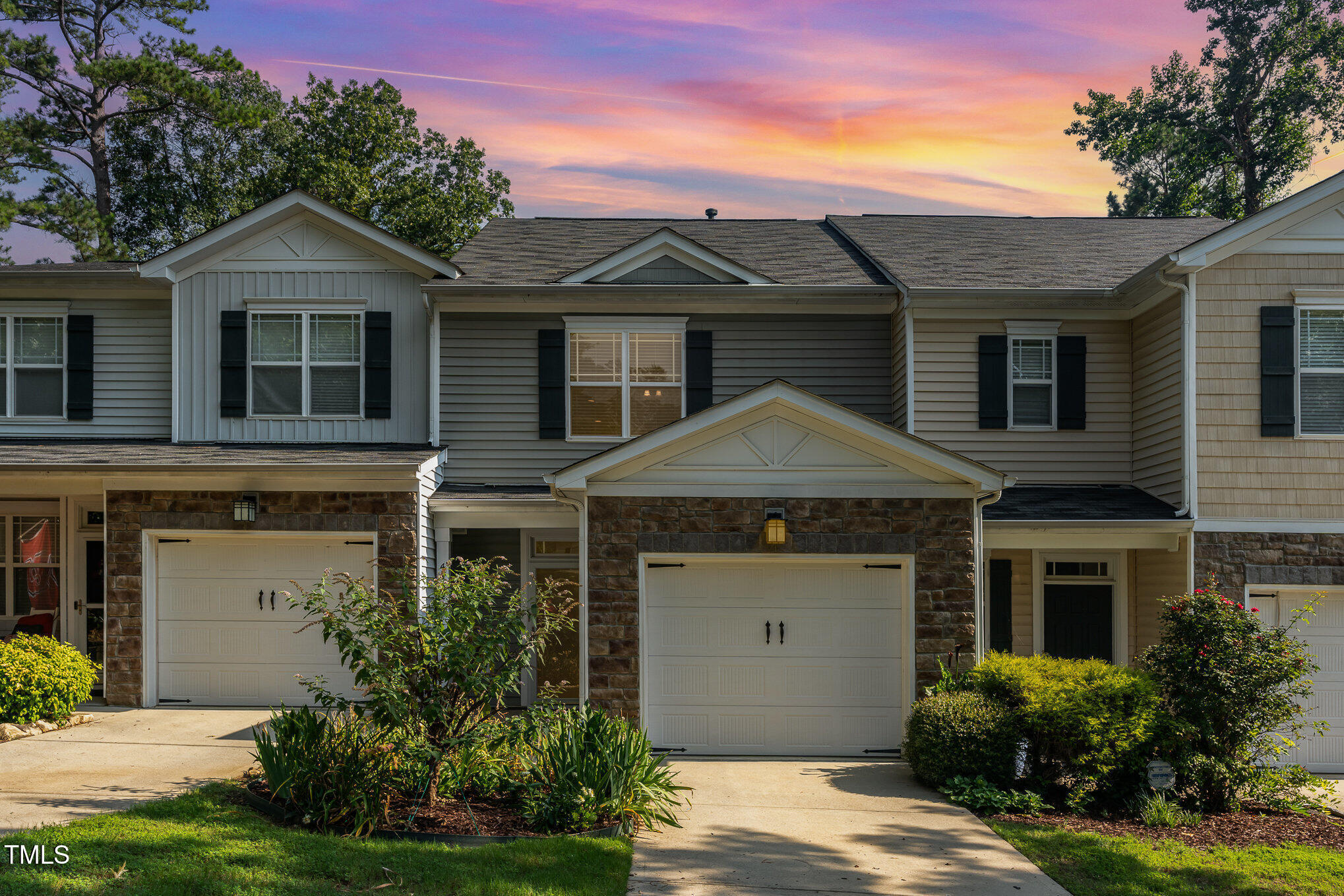 4732 Altha Street Raleigh, NC 27606 - Photo 2 of 23 a front view of a house with a yard and garage