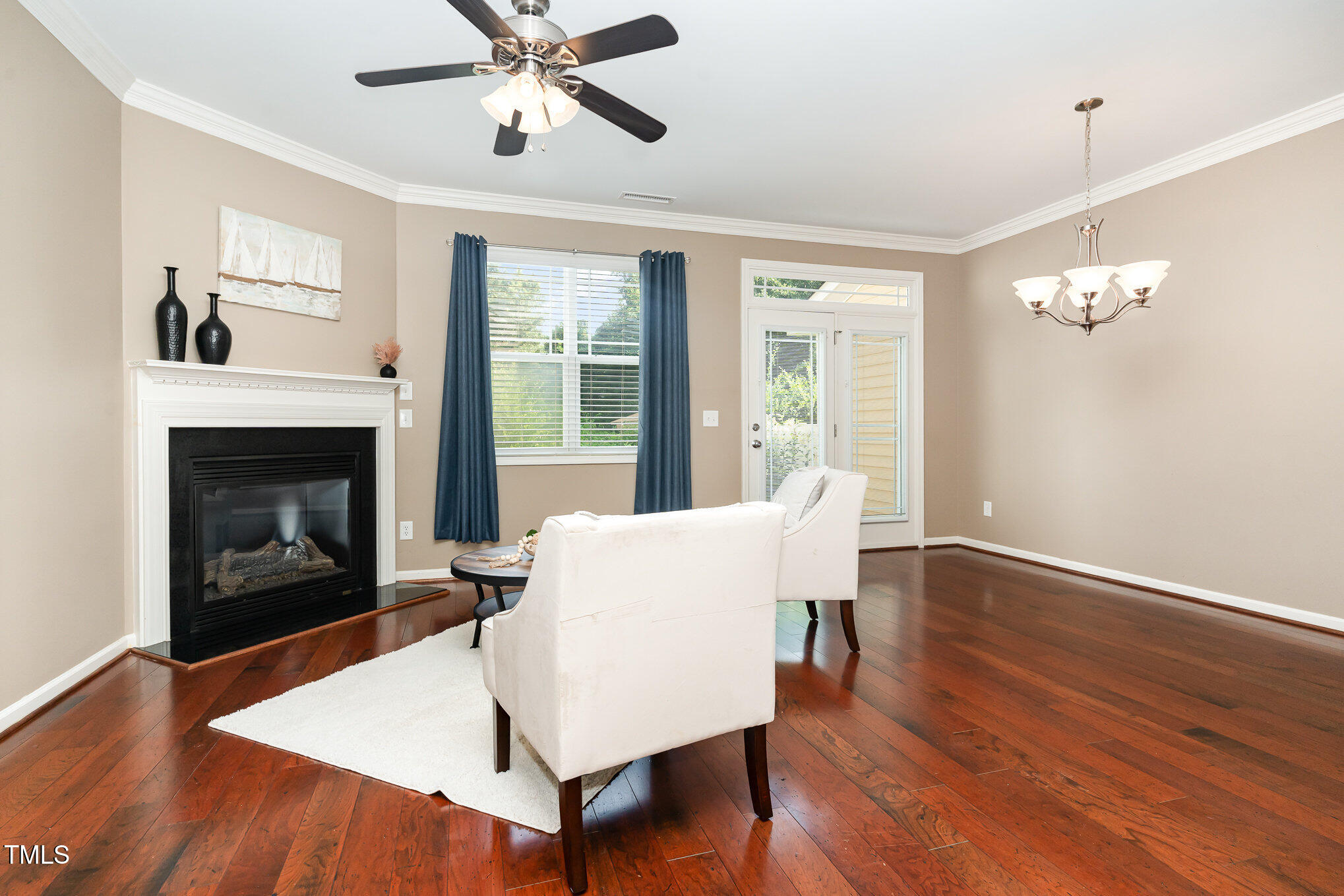 4732 Altha Street Raleigh, NC 27606 - Photo 4 of 23 a living room with furniture and a fireplace