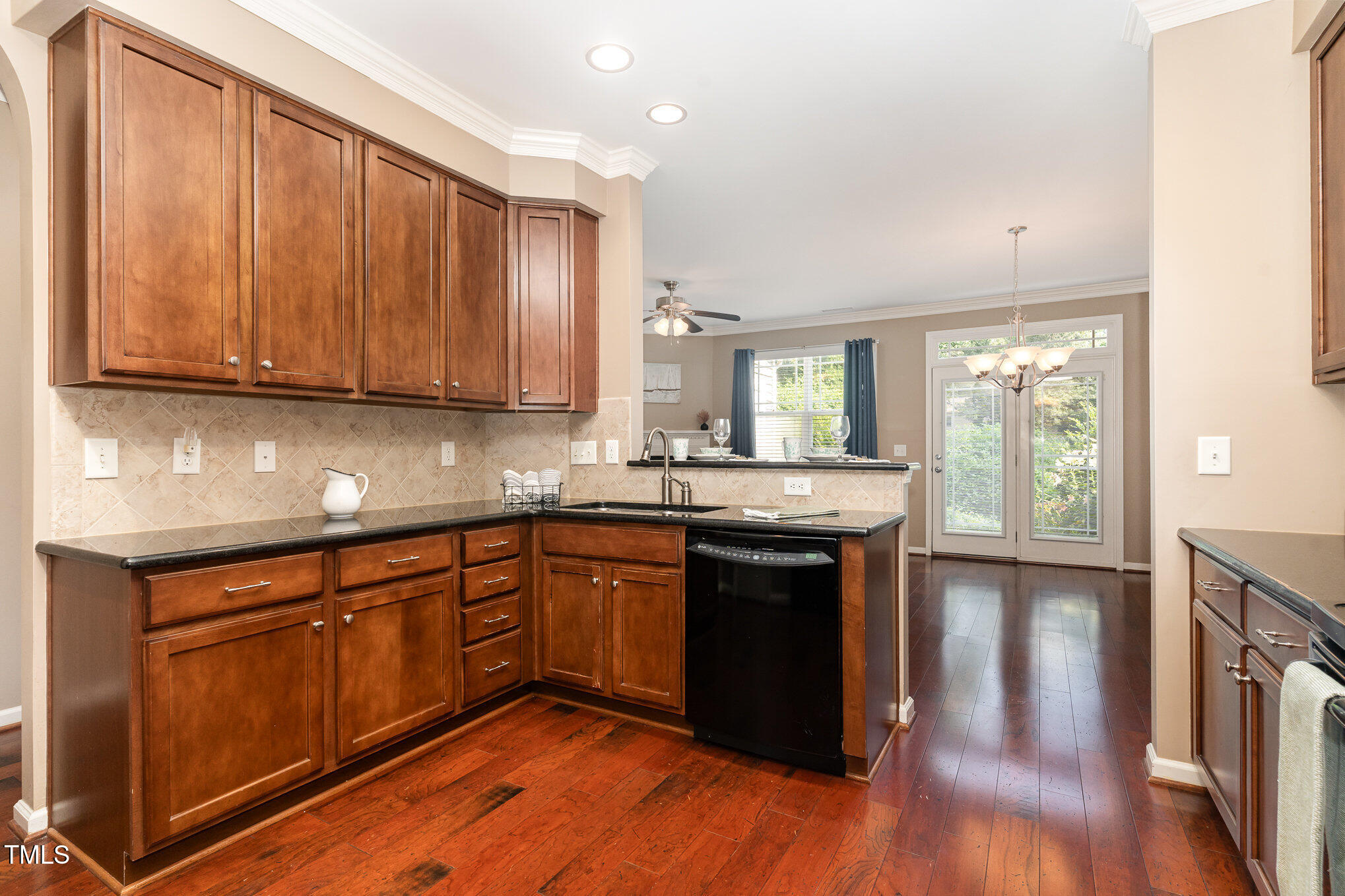 4732 Altha Street Raleigh, NC 27606 - Photo 8 of 23 a kitchen with granite countertop wooden floors and sink
