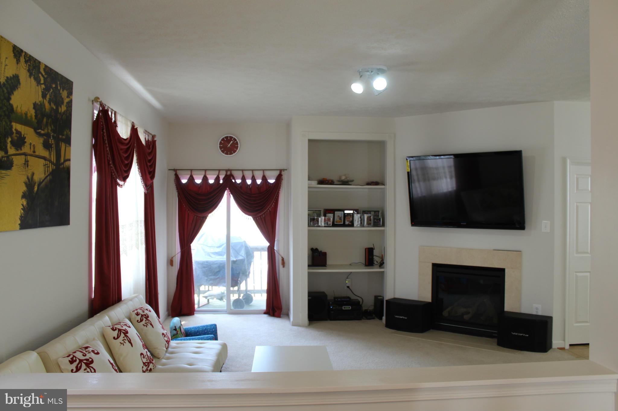 9604 Maxwell Road Middle River, MD 21220 - Photo 4 of 16 a living room with furniture and a flat screen tv