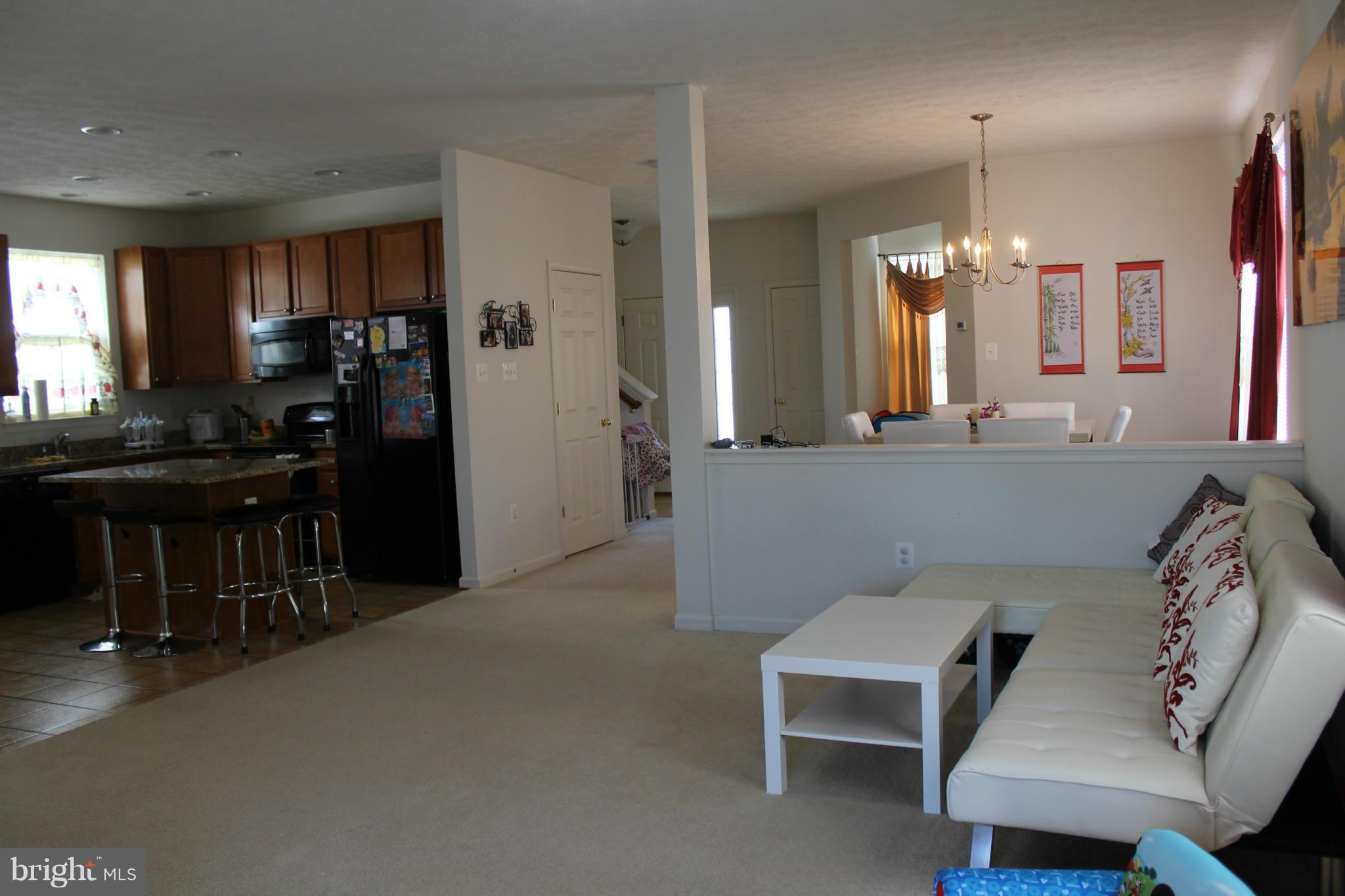 9604 Maxwell Road Middle River, MD 21220 - Photo 5 of 16 a living room with furniture and a chandelier