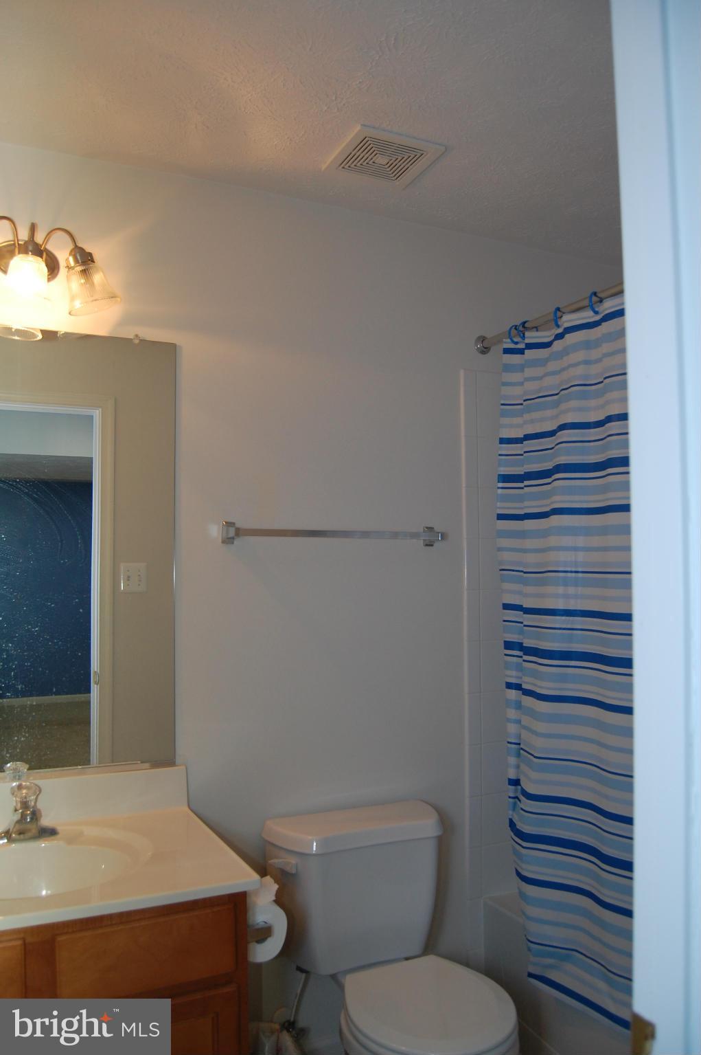9604 Maxwell Road Middle River, MD 21220 - Photo 8 of 16 a bathroom with a sink a toilet and shower