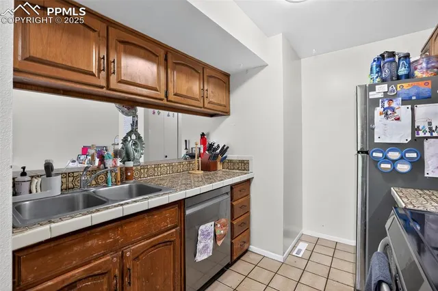 a room with a sink and a mirror