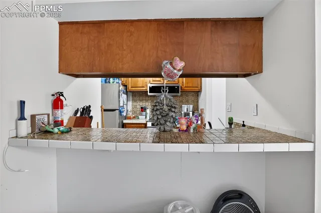a view of a dining room with furniture and window