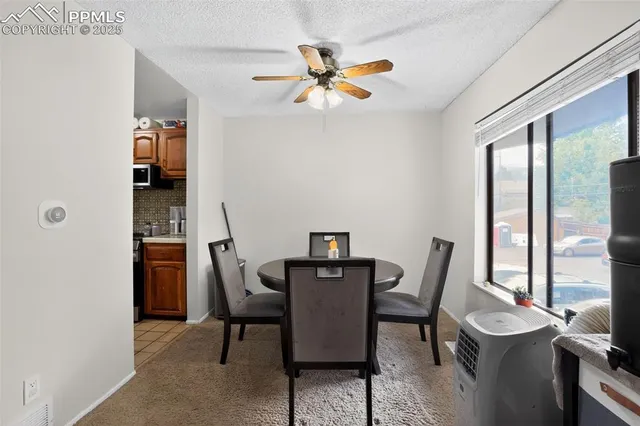 a living room with furniture and flat screen tv