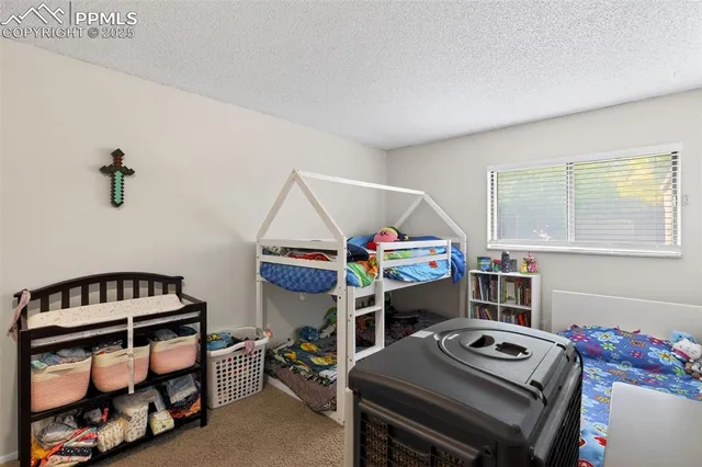 a bedroom with a bed and a table in it