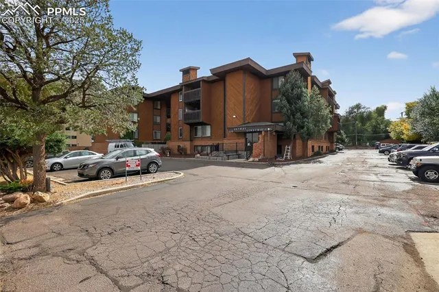 a view of street with parked cars