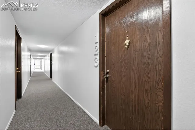 a view of a kitchen with appliances and wooden floor