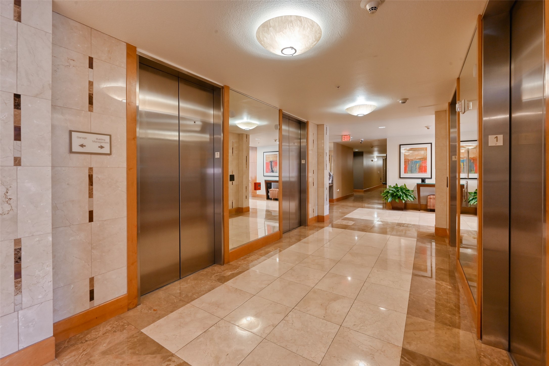 3505 Sage Road, Unit 1206 Houston, TX 77056 - Photo 15 of 50 a view of a hallway with wooden floor