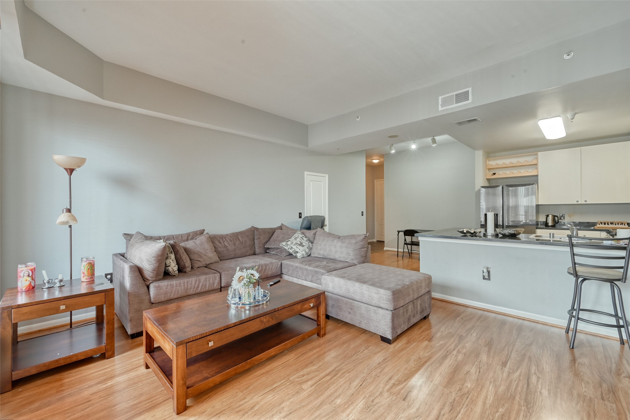 3505 Sage Road, Unit 1206 Houston, TX 77056 - Photo 23 of 50 a living room with furniture and wooden floor