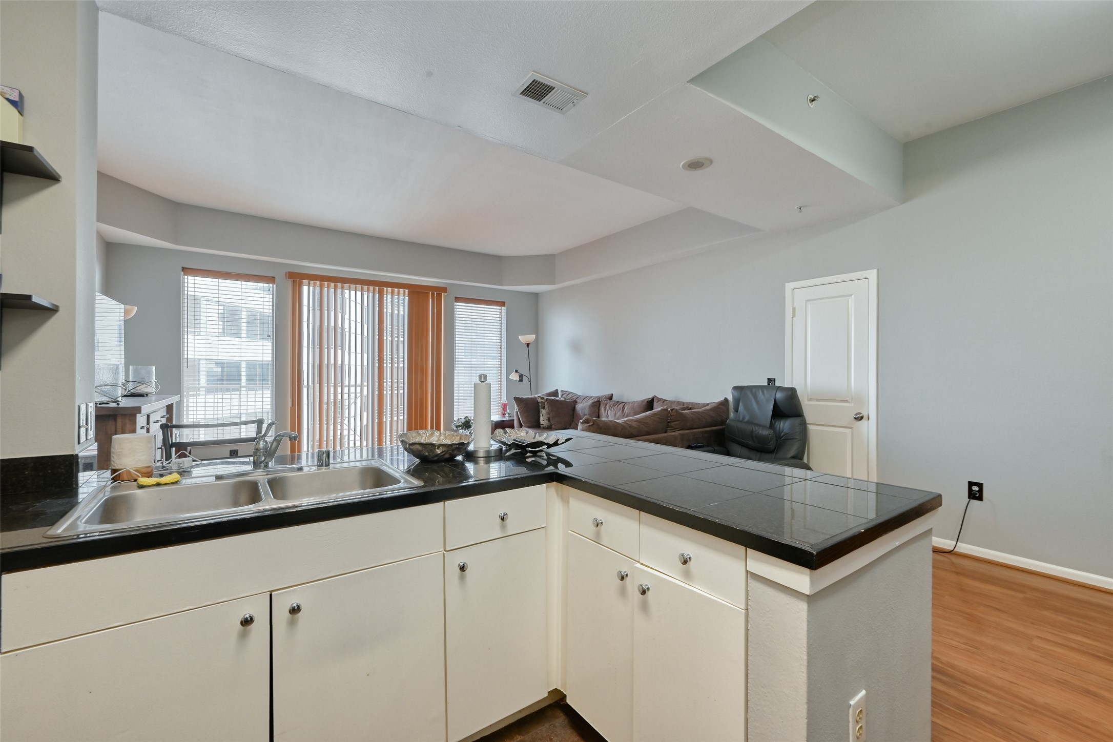 3505 Sage Road, Unit 1206 Houston, TX 77056 - Photo 29 of 50 a kitchen with a sink and cabinets