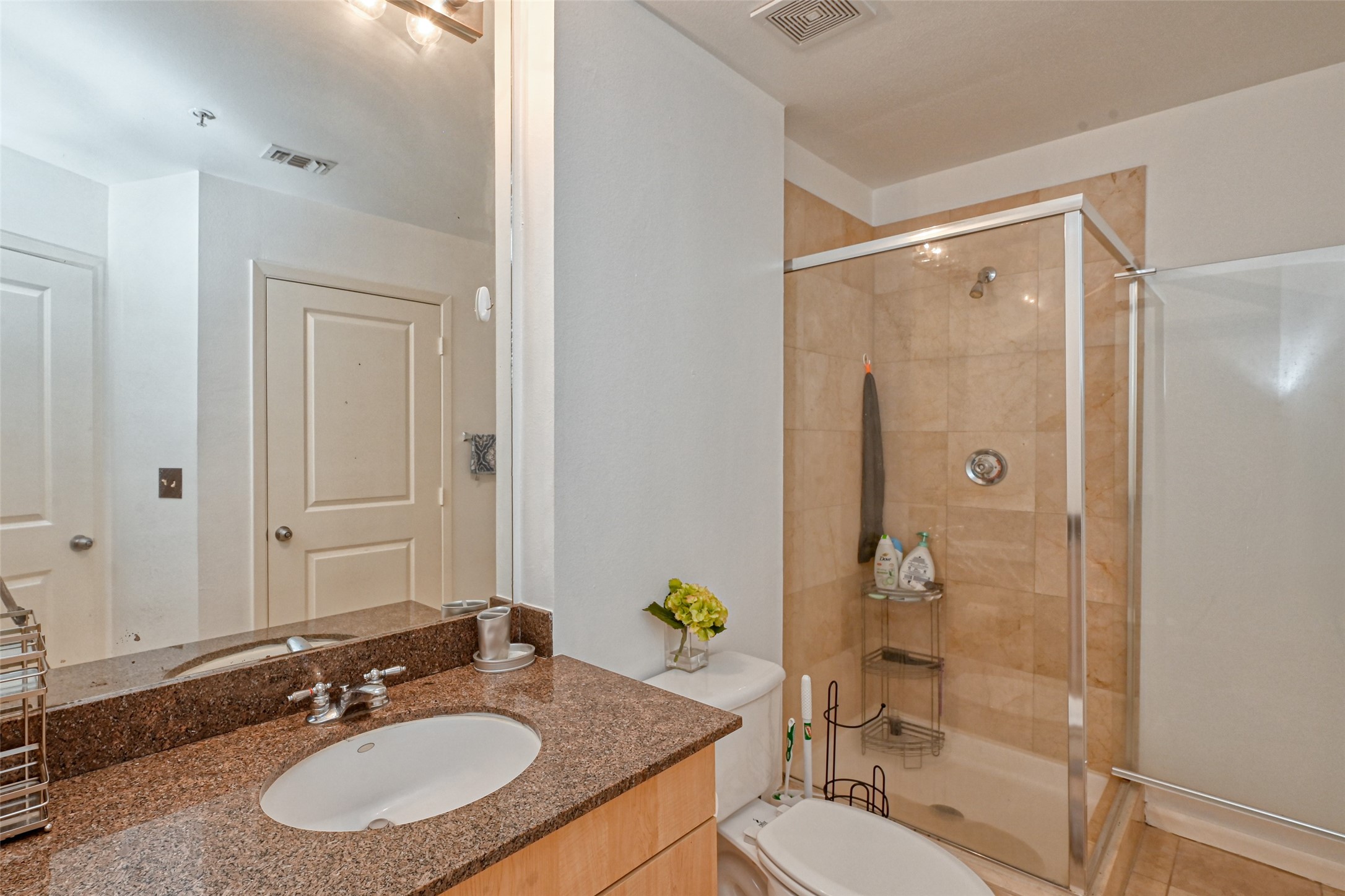 3505 Sage Road, Unit 1206 Houston, TX 77056 - Photo 33 of 50 a bathroom with a sink double vanity granite tub shower and a mirror