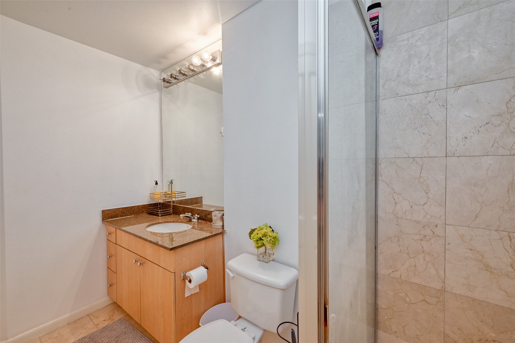 3505 Sage Road, Unit 1206 Houston, TX 77056 - Photo 35 of 50 a utility room with granite countertop a sink a toilet and a shower