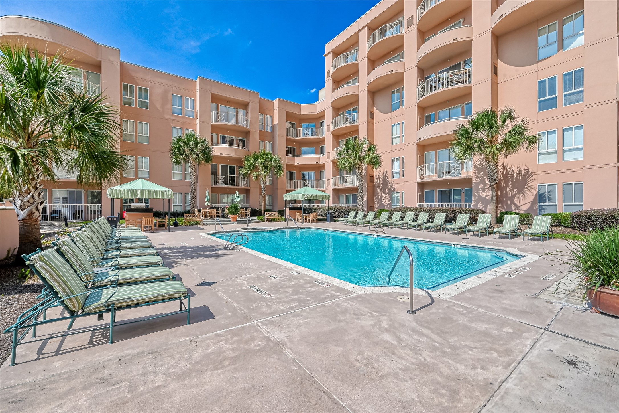 3505 Sage Road, Unit 1206 Houston, TX 77056 - Photo 45 of 50 a building with swimming pool and outdoor seating