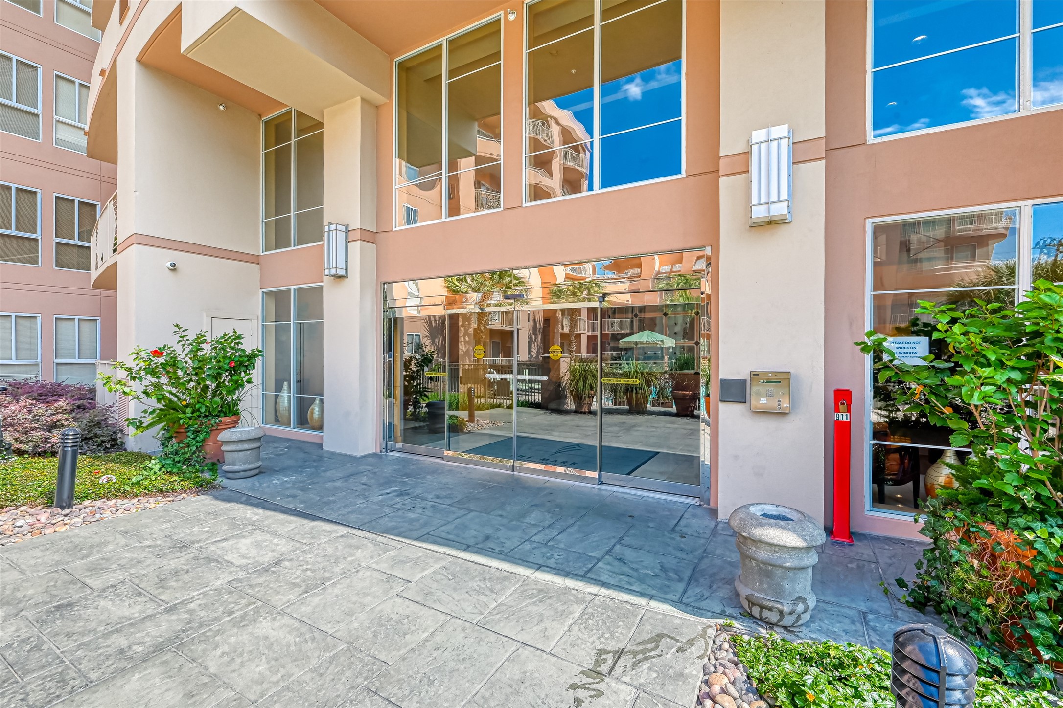 3505 Sage Road, Unit 1206 Houston, TX 77056 - Photo 5 of 50 a building with potted plants in front of it