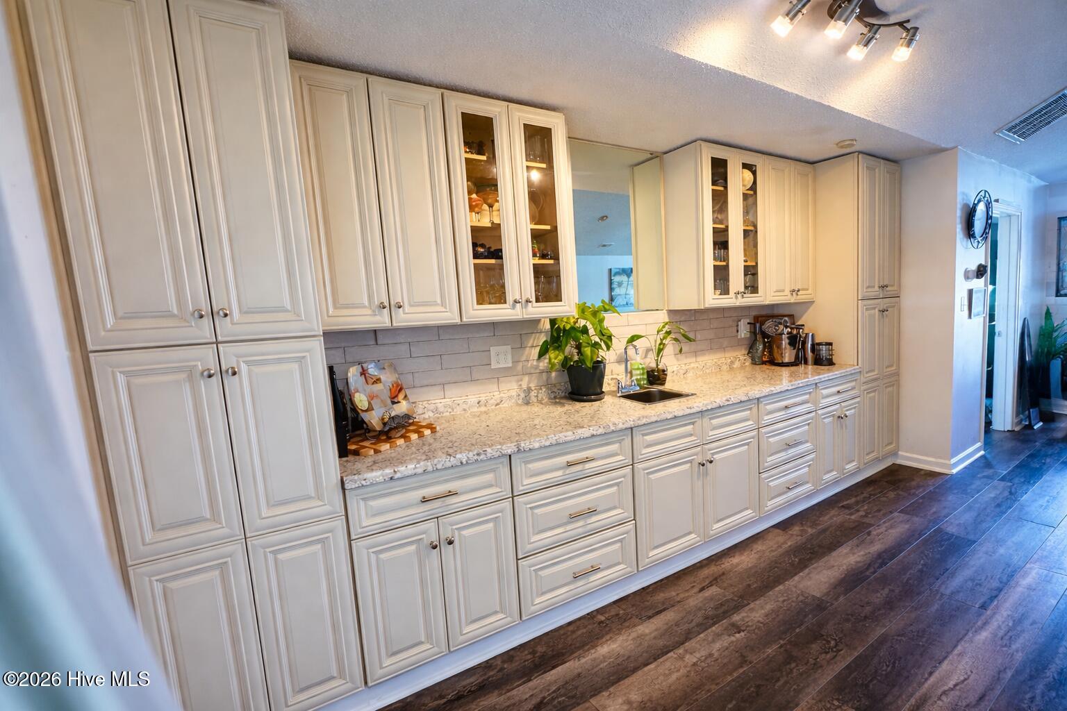 330 Cape Lookout Loop Emerald Isle, NC 28594 - Photo 13 of 50 Custom upgraded cabinets and wet bar