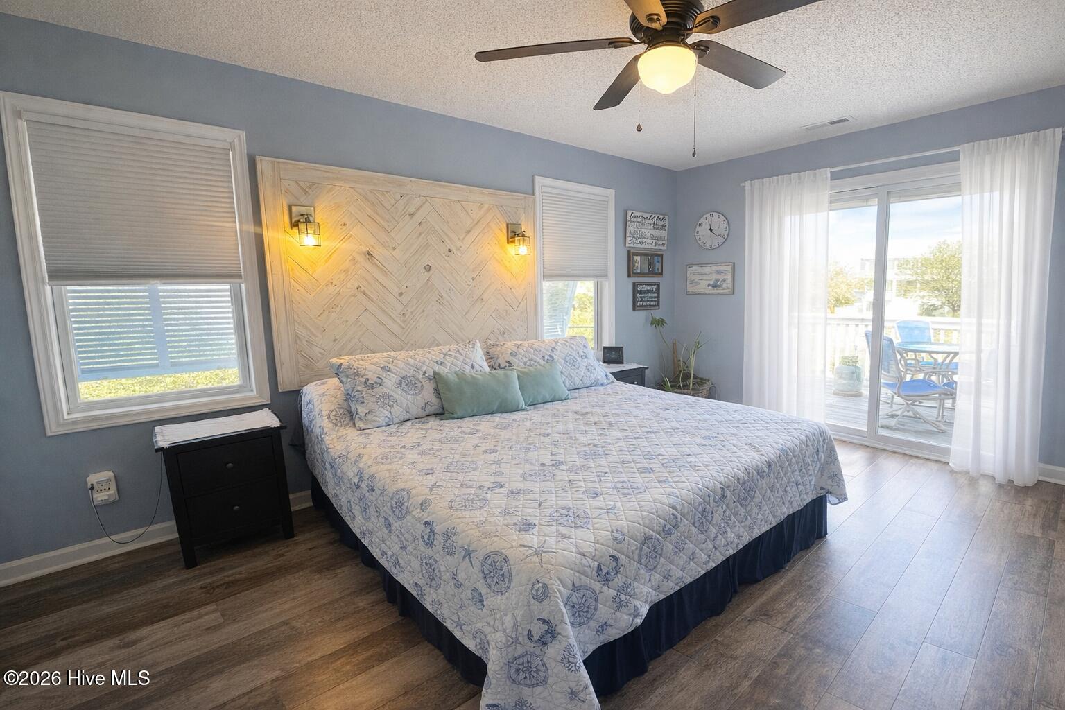 330 Cape Lookout Loop Emerald Isle, NC 28594 - Photo 20 of 50 Master Bedroom slider door replaced this year and looks out into deck and sound side with pond views of the sound and water
