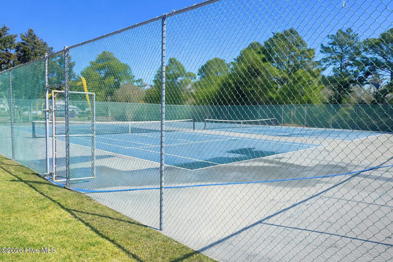 330 Cape Lookout Loop Emerald Isle, NC 28594 - Photo 39 of 50 Tennis and pickleball courts next to clubhouse and clubhouse is right next to the property