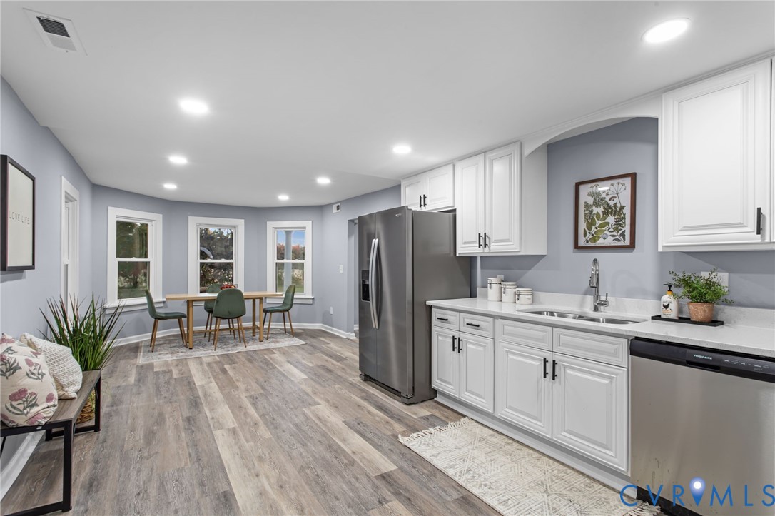 7946 Howerton Road Dunnsville, VA 22454 - Photo 11 of 47 a kitchen with a sink and refrigerator