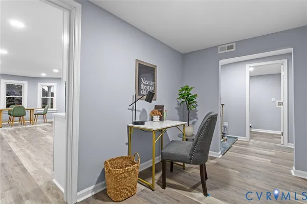 a view of a dining room with furniture window and wooden floor