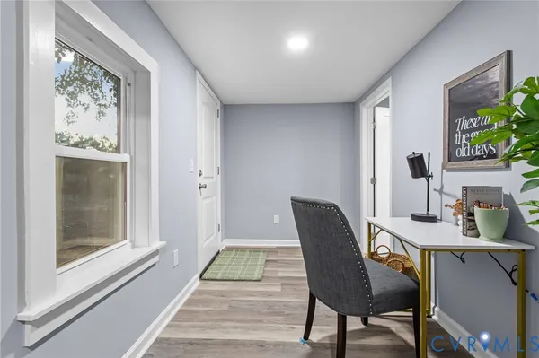 a workspace with furniture and window