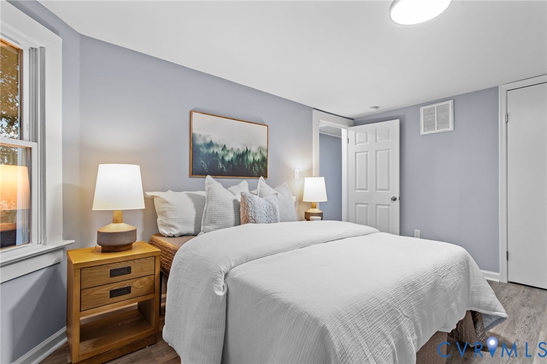 7946 Howerton Road Dunnsville, VA 22454 - Photo 24 of 47 a bedroom with a bed and a window