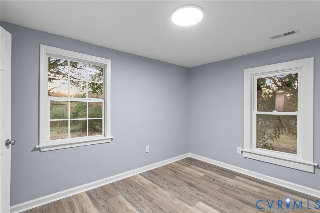 7946 Howerton Road Dunnsville, VA 22454 - Photo 25 of 47 an empty room with windows