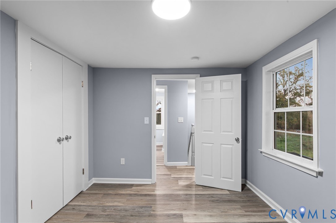 7946 Howerton Road Dunnsville, VA 22454 - Photo 26 of 47 an empty room with windows and closet