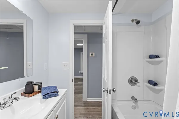 a bathroom with a sink and a shower