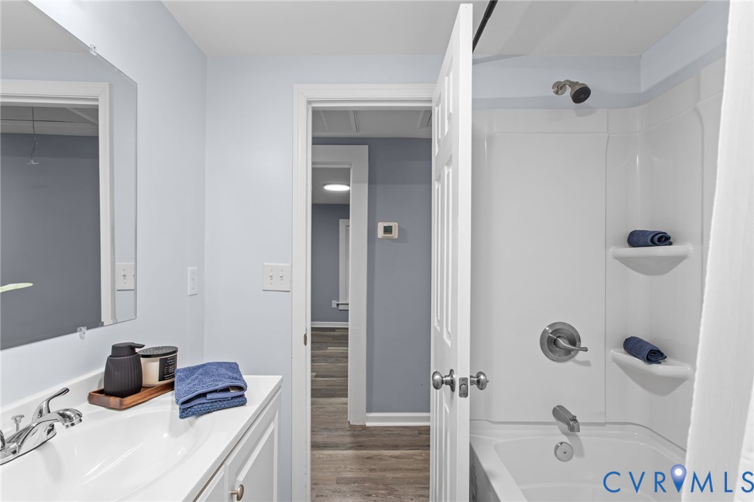 7946 Howerton Road Dunnsville, VA 22454 - Photo 29 of 47 a bathroom with a sink and a shower