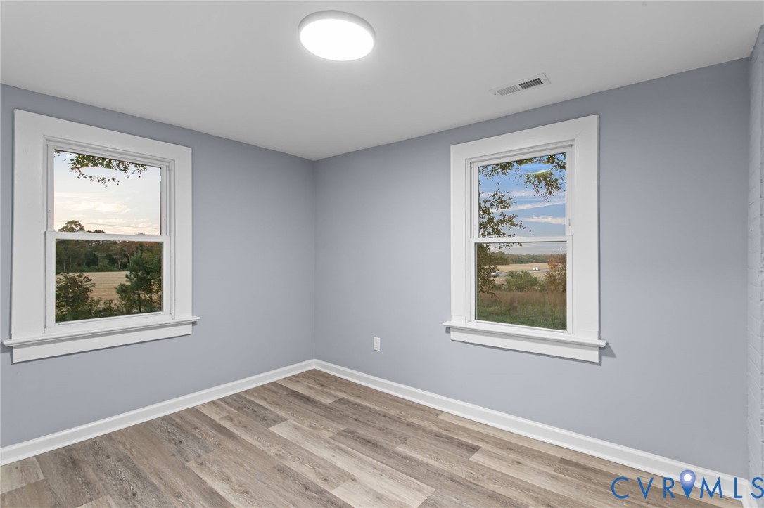 7946 Howerton Road Dunnsville, VA 22454 - Photo 30 of 47 a view of empty room with window and closet