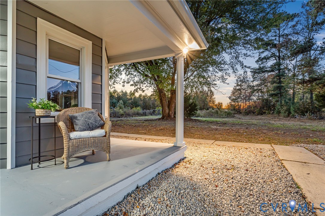 7946 Howerton Road Dunnsville, VA 22454 - Photo 32 of 47 a view of a patio with chair and table in the patio