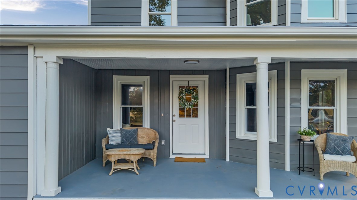 7946 Howerton Road Dunnsville, VA 22454 - Photo 34 of 47 a view of a chair and door in the balcony