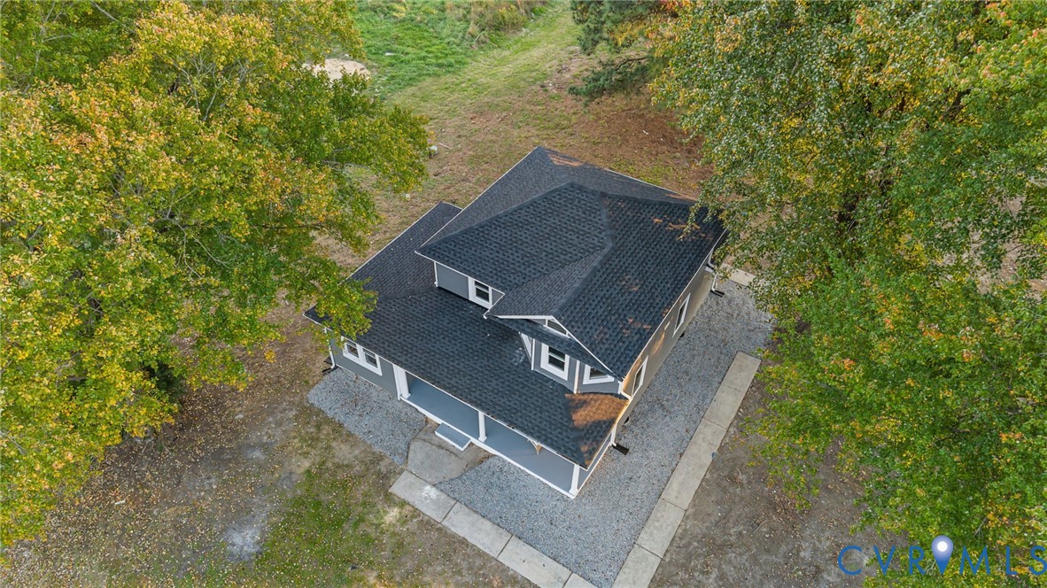 7946 Howerton Road Dunnsville, VA 22454 - Photo 35 of 47 front view of a house with a yard