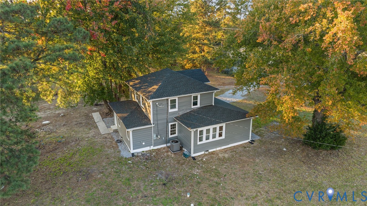 7946 Howerton Road Dunnsville, VA 22454 - Photo 40 of 47 front view of a house with a yard