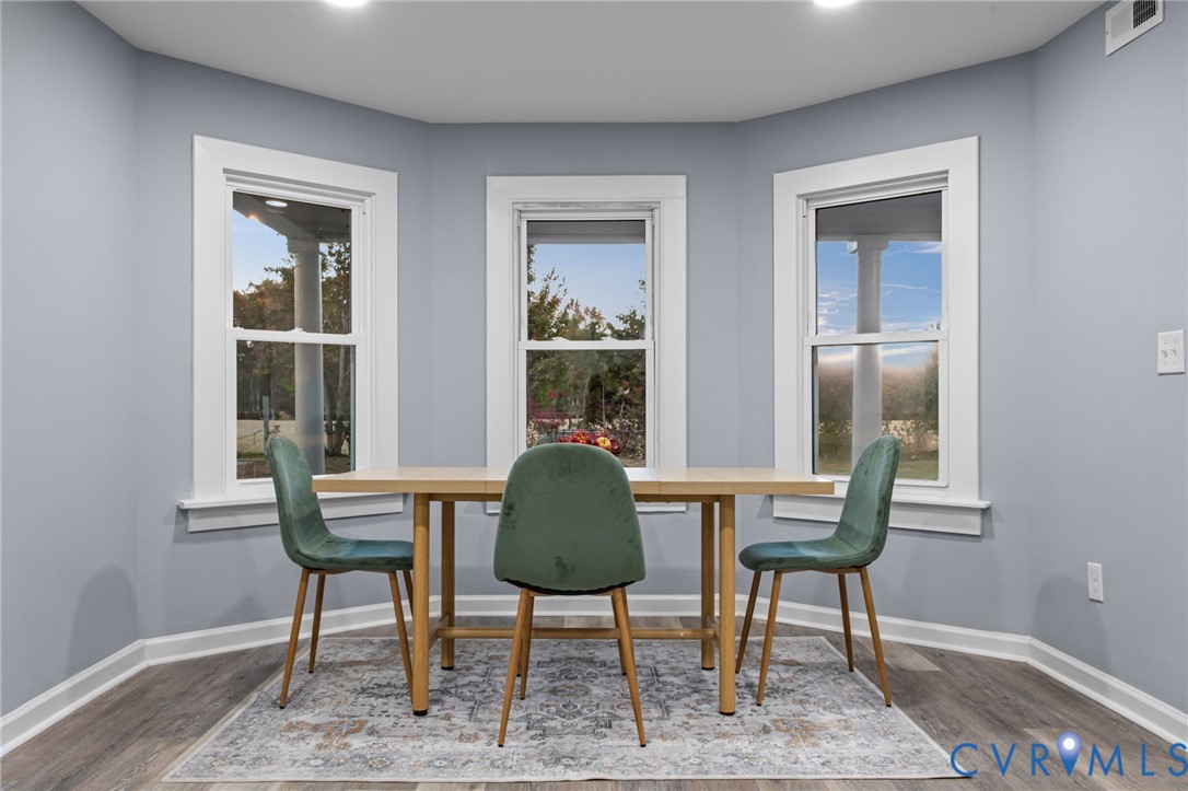 7946 Howerton Road Dunnsville, VA 22454 - Photo 8 of 47 a living room with furniture and a window